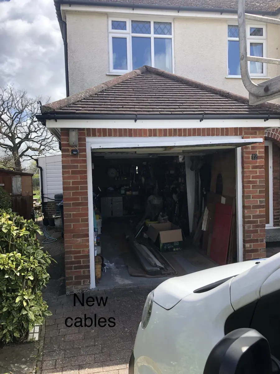 The same garage door sitting level after new cables were fitted